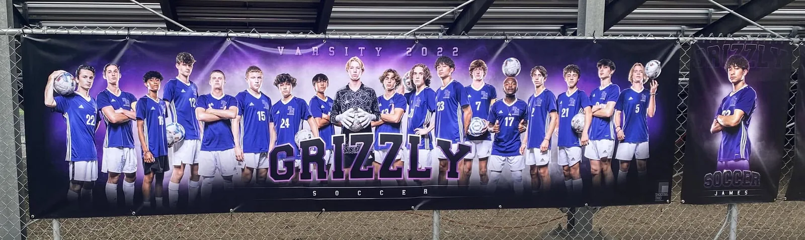 Rocky Mountain varsity soccer team composite banner and an individual senior banner hanging side by side on the fence Meridian Idaho