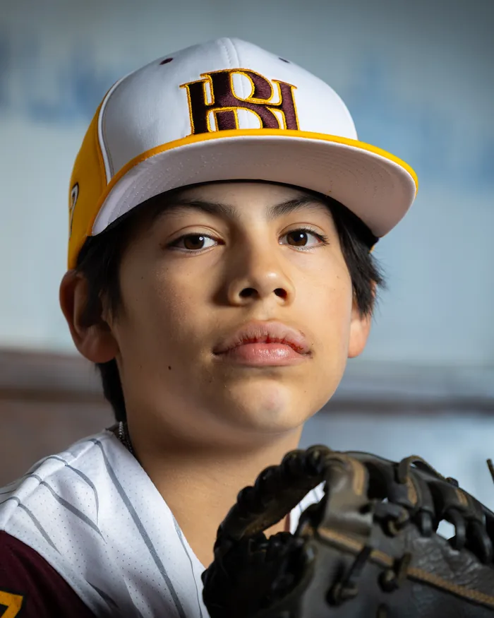 Idaho Hype baseball player close-up in the dugout, Boise Idaho