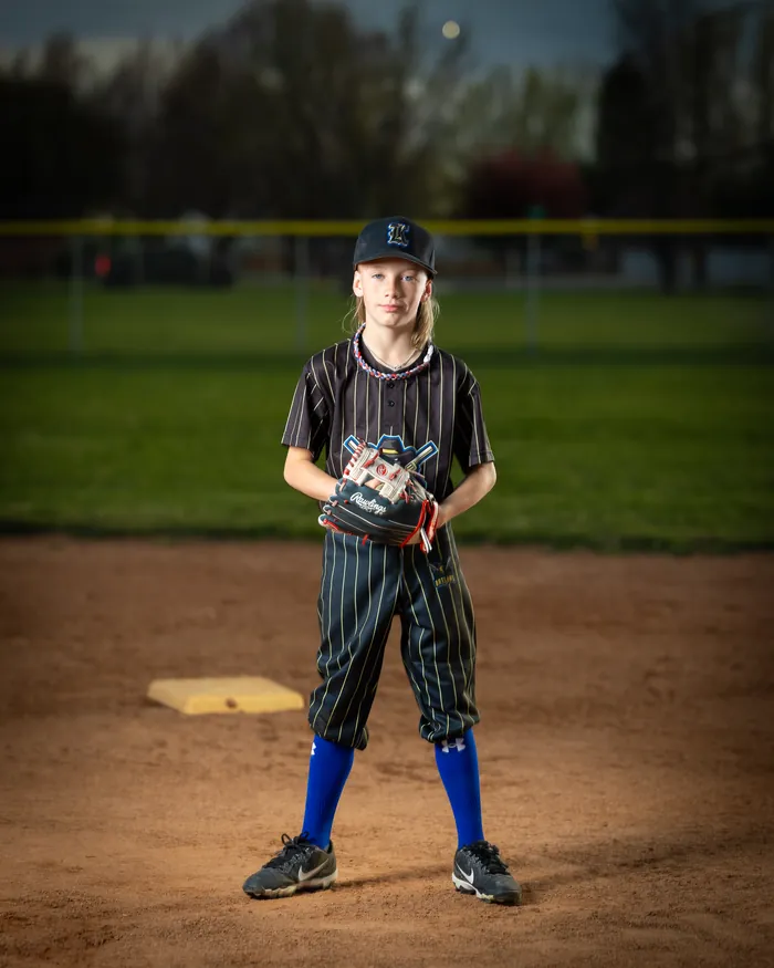 Kuna Outlaws youth baseball player standing at third base with a glove, Kuna Idaho
