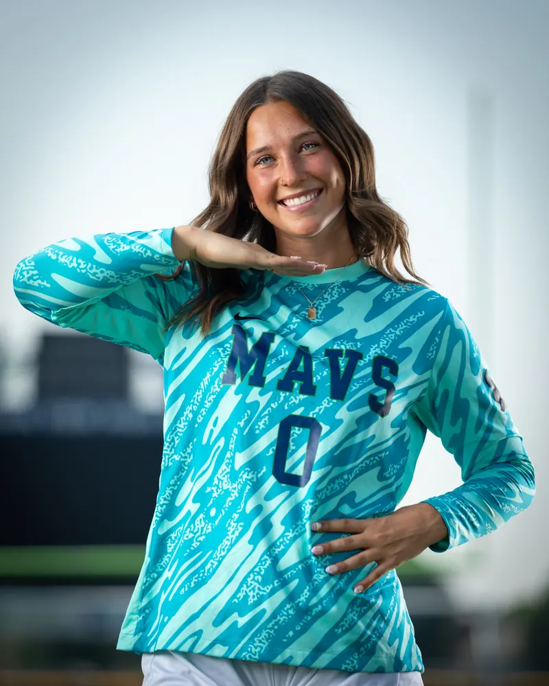 Addyson Crumley #0 waist up with her hand under her chin, the photo used on her senior banner