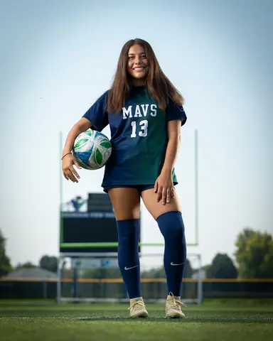 Alexa Martinez #13 full length from a low angle, holding the ball at her hip