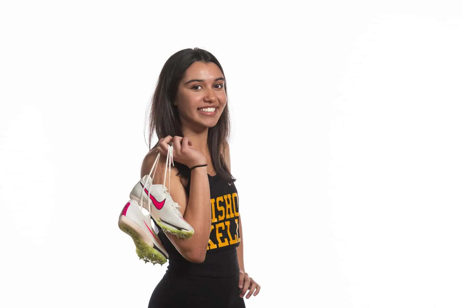 Professional sprinter portrait with starting blocks dramatic lighting