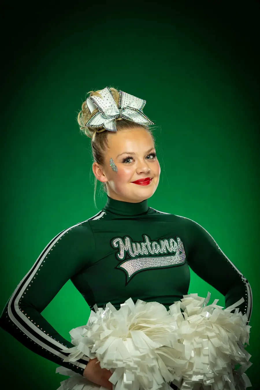 Eagle High School Mustangs cheerleader portrait with poms