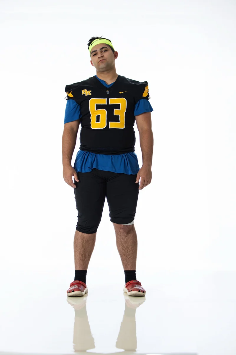 Football player not game ready for sports portraits: wrong shoes, casual attire