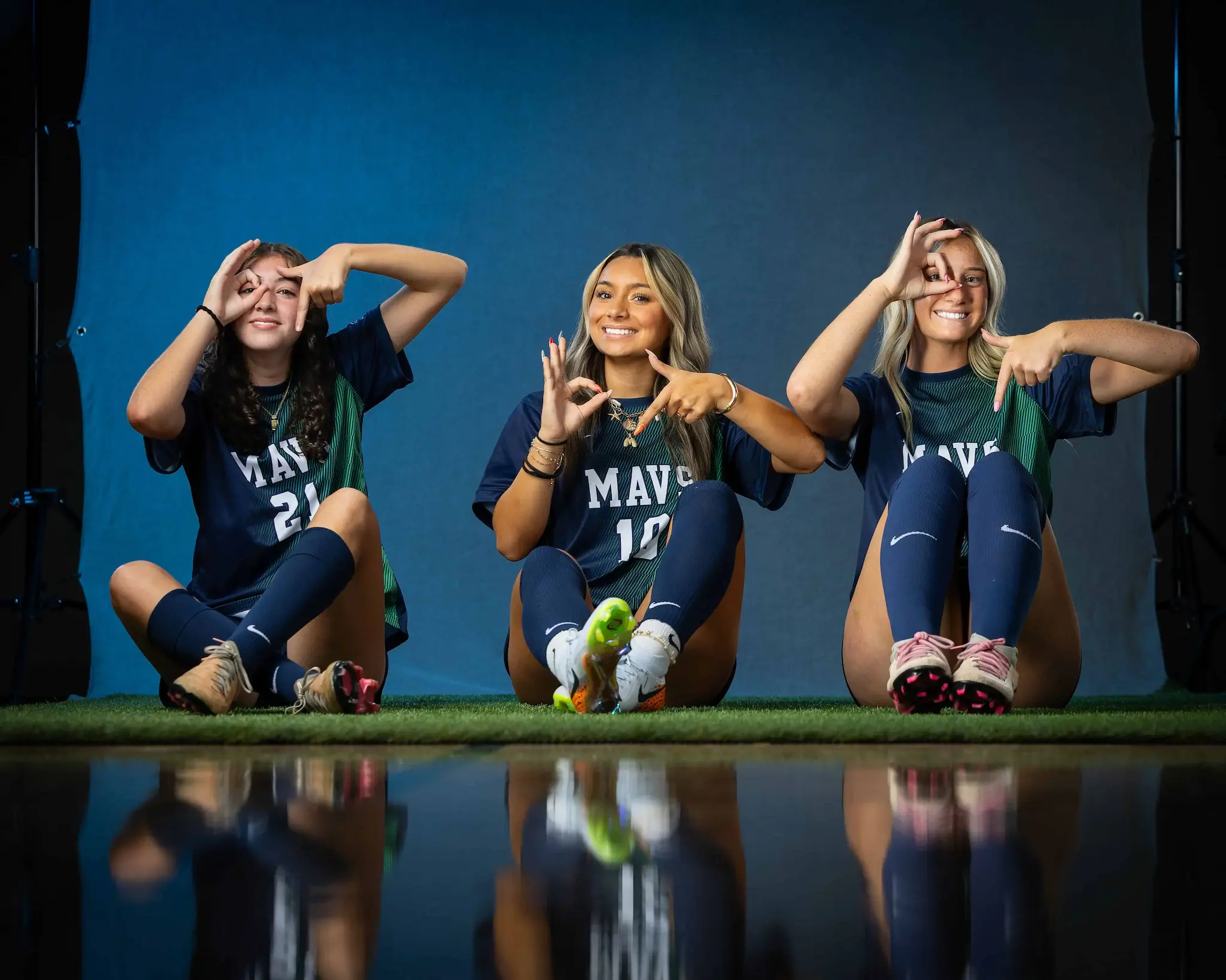 Mountain View High School Varsity Girls Soccer players doing the 6-7 trend gesture at media day