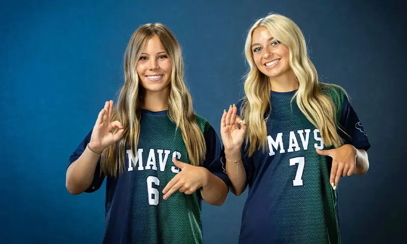 Youth soccer athletes doing the 6-7 trend hand gesture in Idaho