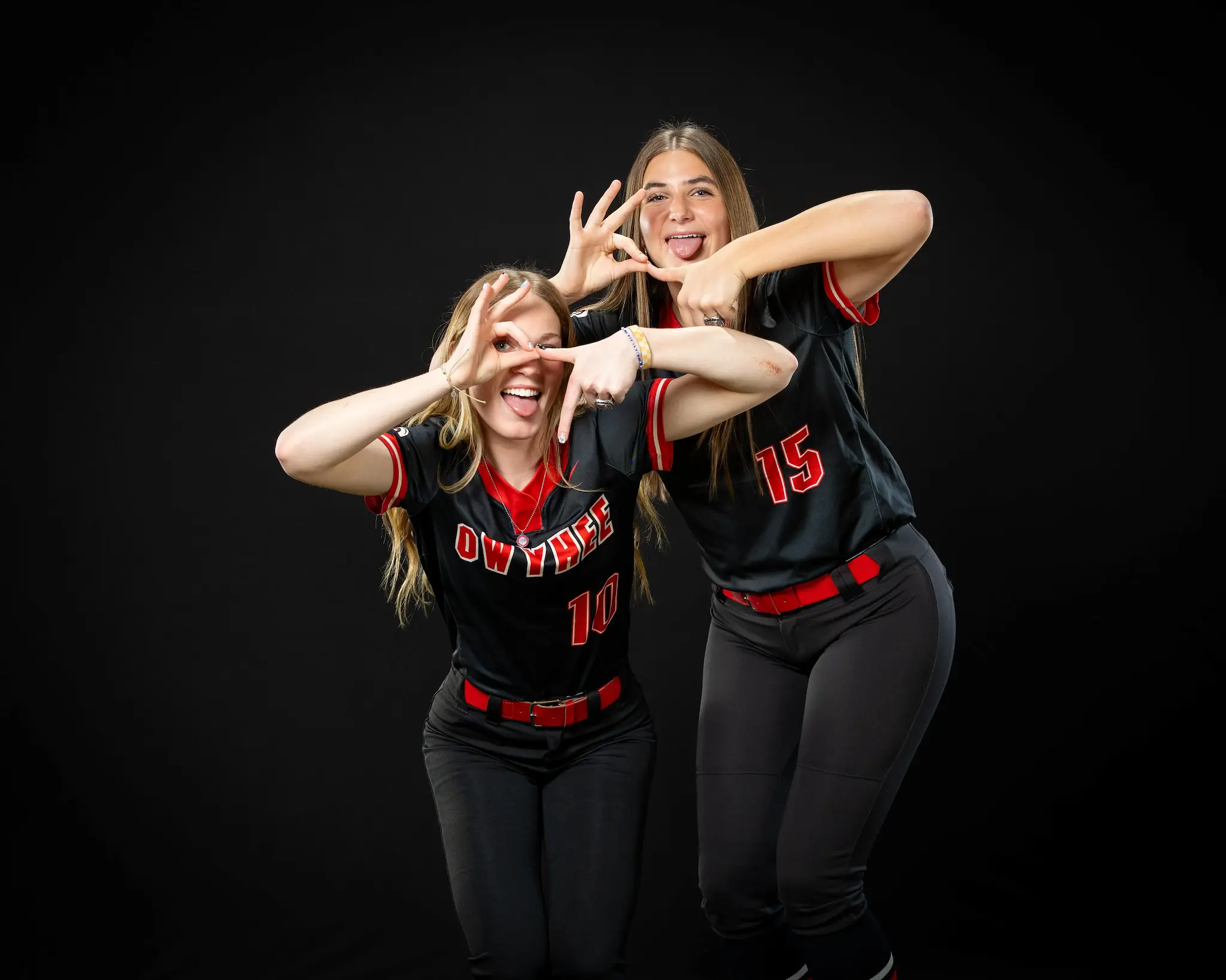 Owyhee High School Softball players doing the 6-7 trend gesture at media day