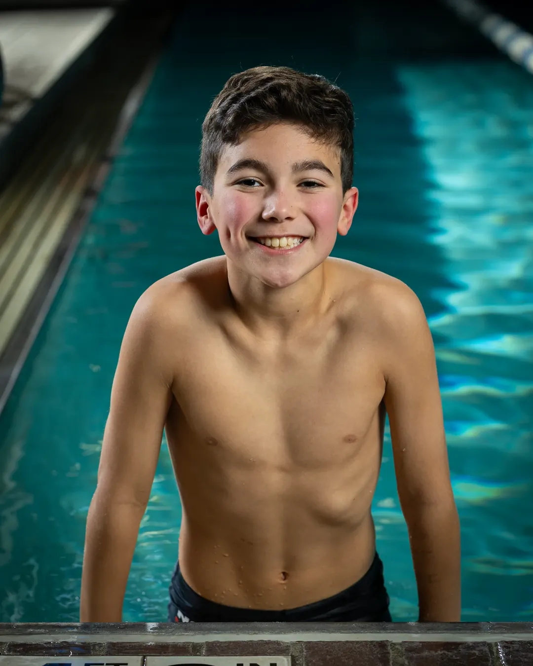 Nampa swim team swimmer portrait at the pool edge Nampa Idaho