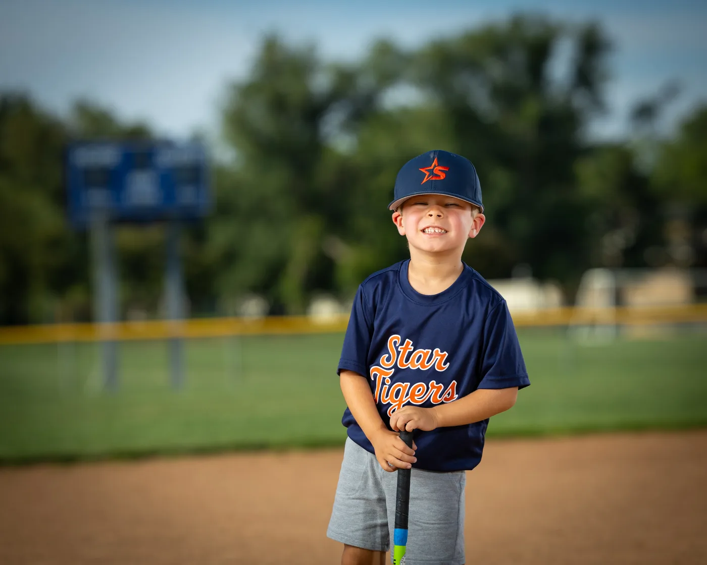 Star Tigers youth baseball player laughing at the plate, Star Idaho